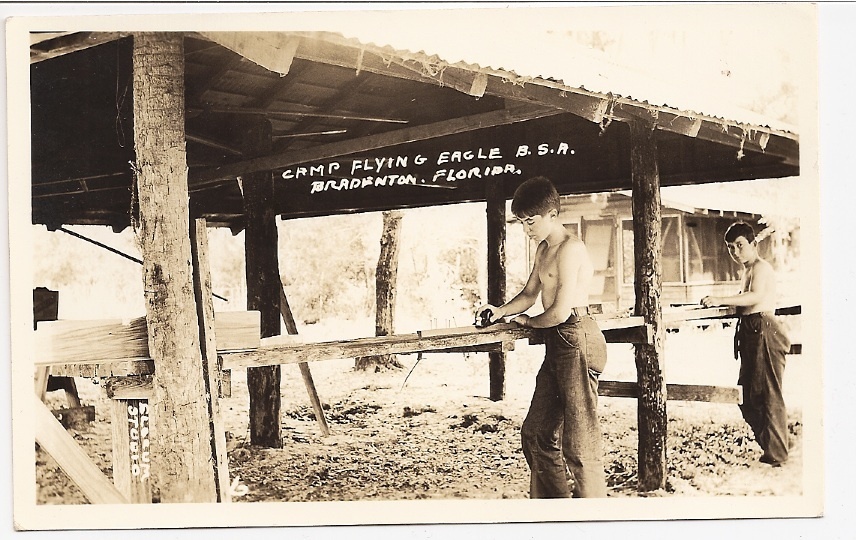 Postcard of CFE showing youth working on canoe