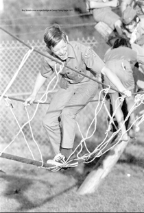 Boy Scouts cross a rope bridge at Camp Flying Eagle 1977.tiff